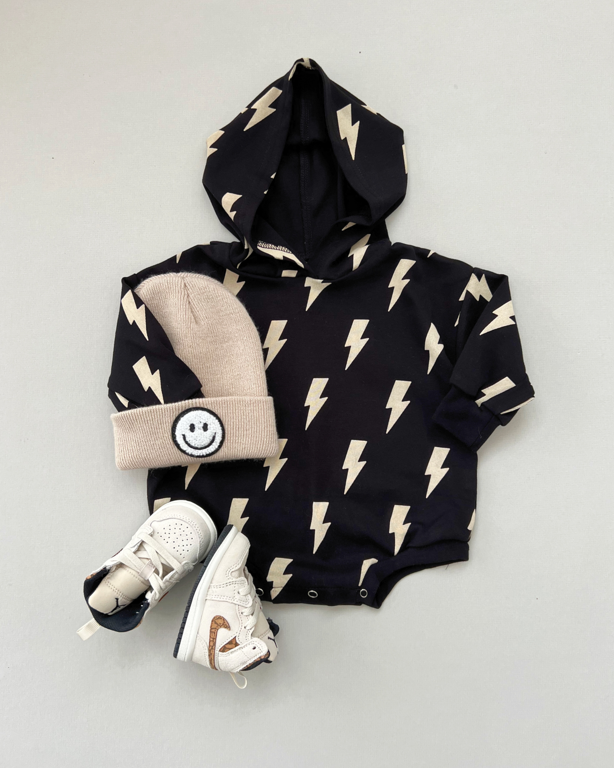 Hooded Bubble Romper | Black Bolts - HoneyBug