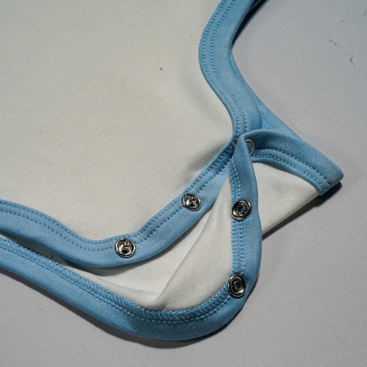 100% Peruvian Pima Cotton White with Chambray Blue Long Sleeve Snap Bodysuit - HoneyBug