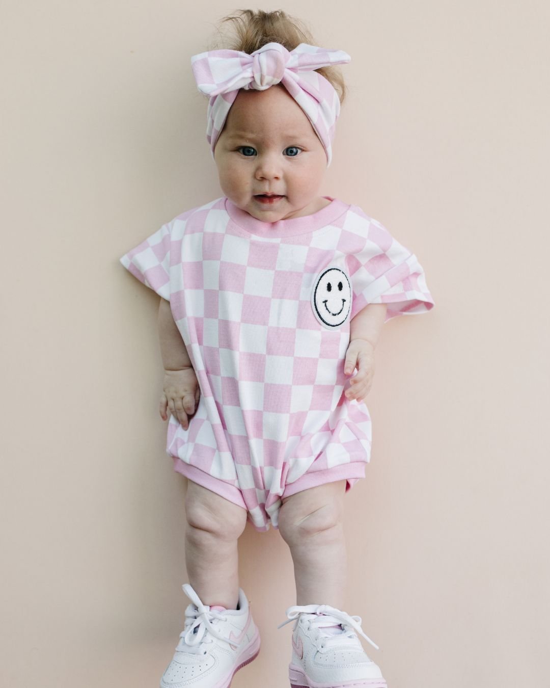 Short Sleeve Bubble Romper | Checkered Smiley Pink - HoneyBug
