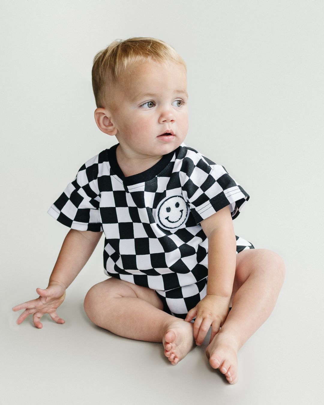 Short Sleeve Bubble Romper | Checkered Smiley Black - HoneyBug 